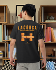 Model wearing a Black tee shirt with Papaya Lacorsa Logotype and Race Car in front of a design bookcase