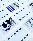 Collection of playing cards with various race designs and text on a white background