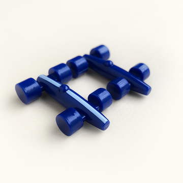 Blue plastic race car pieces on a white background
