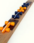 Wooden track with orange and blue cars on a white background