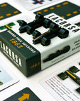 The image shows the Lacorsa 1963 Racecar Set packaging with two dark green racecars with gold stripes and several playing cards related to the 1963 Grand Prix season.