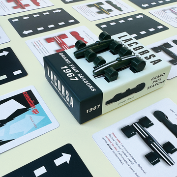 Lacorsa Grand Prix Seasons 1967 model car set with packaging on a light surface with cards.