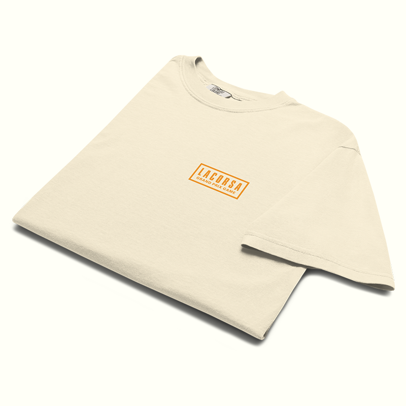 Folded Beige t-shirt with a Lacorsa Grand Prix Game logo on right chest on a white background