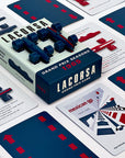 The image shows the Lacorsa 1965 Racecar Set packaging with two blue toy racecars on top and several playing cards spread out with racing themes.
