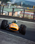 Vintage racing car on a track with a blurred background