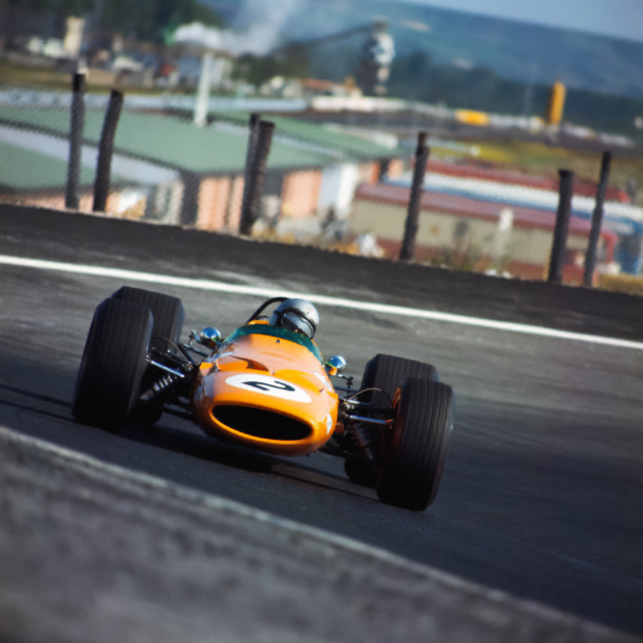 Vintage racing car on a track with a blurred background