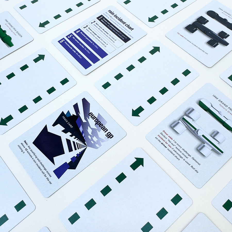 Collection of playing cards with various race designs and text on a white background
